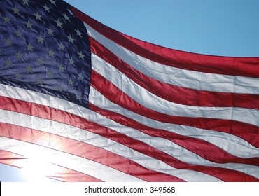 A Huge Flag Hanging On A Main Street In A Small Town On Memorial Day In The Usa