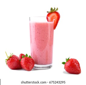 A huge glass with pink drinks or beverages from juicy and fresh red strawberries and organic milk and beautiful strawberries are around, isolated on a white background. Delicious pink smoothie.