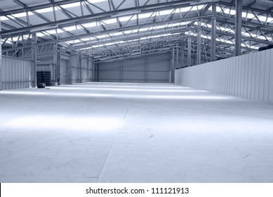 Huge Gray Empty And Light Warehouse With Metal Roof