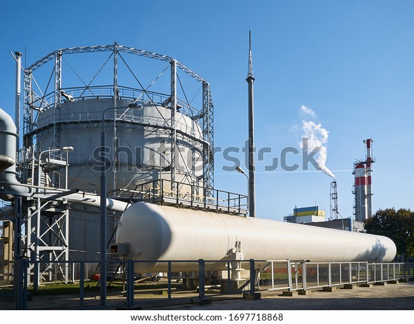 Huge horizontal liquid oxygen tank for\
needs of medical institutions and hospitals and cylindrical oxygen\
gas-holder as example of chemical equipment\
example.
