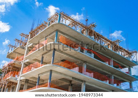 Huge hotel complexes are being built construction sites in Playa del Carmen Mexico.