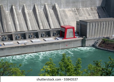 A Huge Hydro Electric Power Plant On A River.