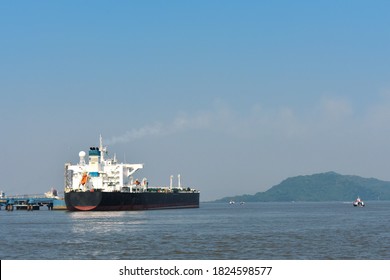 A Huge Merchant Ship In The Middle Of The Ocean