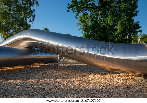 a huge metal tube in\
an amusement park