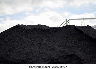 Huge Mountain Of Hard Coal And A Steel Structure For Transporting Coal In A Concept Of Energy Crisis And Energy Shortage