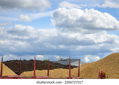 Huge Mountain Of Sawdust And Black Coal In A Concept Of Energy Crisis And Energy Shortage With Blue Sky In The Background