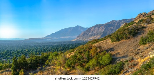 Huge Mountains Overlooking City Of Ogden In Utah