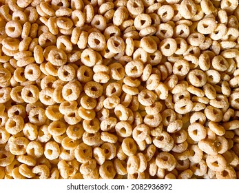 Huge Pile Of Breakfast Cereal Food Round Hoops On The Kitchen Counter Table