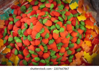 Huge Pile Of Colorful Strawberry Shaped Jelly Sweets On The Candy Shop Window