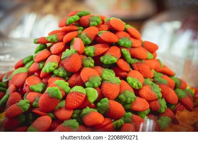 Huge Pile Of Colorful Strawberry Shaped Jelly Sweets On The Candy Shop Window