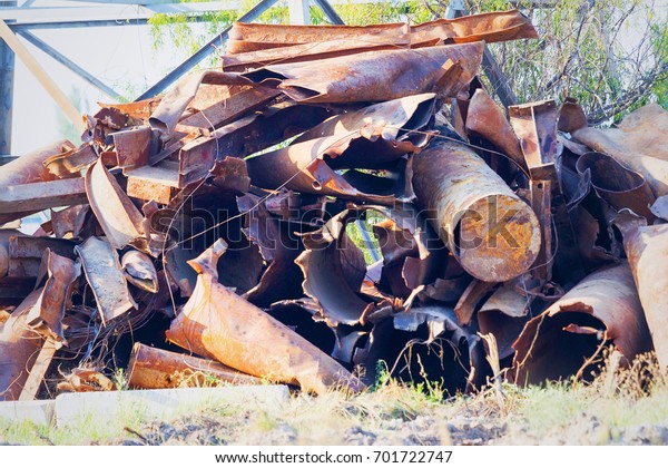 Huge pile of
scrap metal junk garbage with blue sky background. Scrap metal on
recycling plant site.
Chernobyl