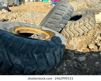 huge piles of used tires discarded on the ground - Powered by Shutterstock