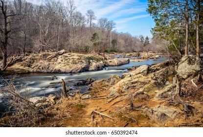 Huge Rocks And The Flowing Waters Of Eno River Captured During Winter Season. This Is One Of The Best Parks In Durham, North Carolina For Nature Hikes And Camping, Just Few Miles From Duke University.