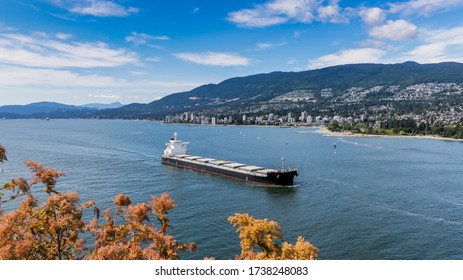 Huge Shipping Freighter Steering Towards The Open Pacific Ocean In Vancouver