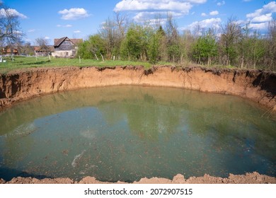 A Huge Sinkhole In The Middle Of The Field