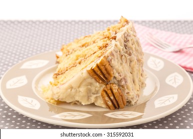 Huge Slice From Triple Layer Italian Cream Cake On Dessert Plate With Selective Focus And Shallow Depth Of Field.