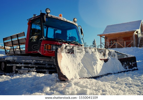Huge snow machine truck\
outdoor.