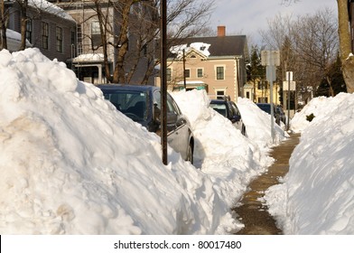 Huge snow piles on city street