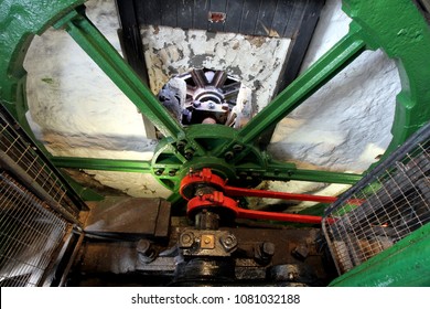 The Huge Steel Flywheel Of An Industrial Steam Engine Used At A Tin Mine In Cornwall.