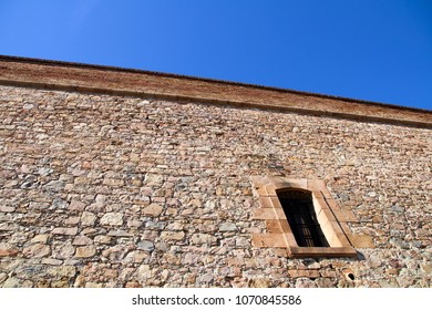 Huge stone wall of a castle - Shutterstock ID 1070845586