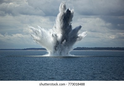 Huge Water Fountain caused by an below surface explosion of a sea mine in the ocean 