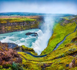 Huge Waterfall Gullfoss In The Morning Mist. Colorful Summer Scene On Hvita River In Southwest Iceland, Europe. Artistic Style Post Processed Photo.