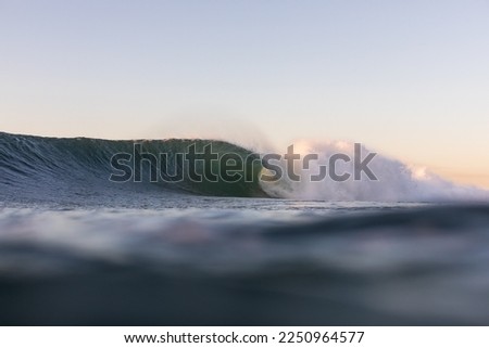 huge wave breaking at a famous beach