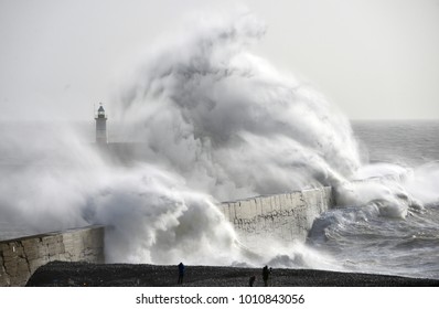 Huge Waves Crash Against A Sea Wall And Lighthouse During A Winter Storm, Newhaven, East Sussex