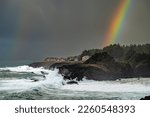 Huge waves during a King tide with a rainbow near Depoe Bay Oregon coast