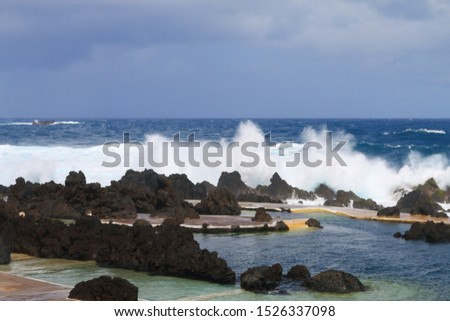 huge waves at the natural swimming pools in Porto Moniz on Madeira, Portugal, Europe