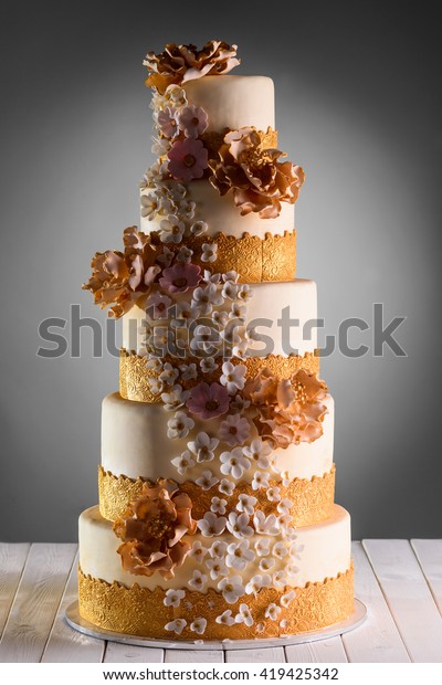 huge-wedding-cake-decorated-many-600w-419425342.jpg