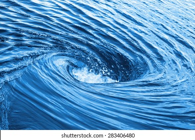 Huge whirlpool on a water surface
