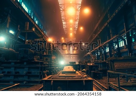 Huge workshop or hangar in metallurgical plant like long corridor, foundry manufacturing, heavy industry