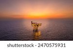 A huge yellow of offshore oil rig drilling platform in the gulf in sunset, Process platform for production oil and gas,Petroleum production and exploration industrial. RC8 Platform