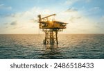 A huge yellow of offshore oil rig drilling platform in the gulf in sunset, Process platform for production oil and gas,Petroleum production and exploration industrial. RC8 Platform