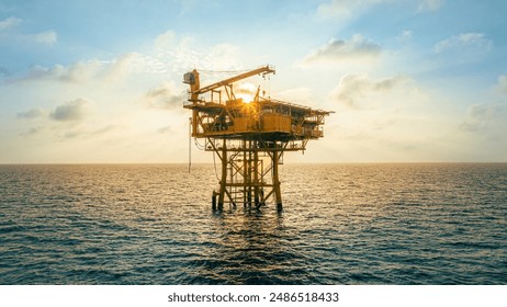 A huge yellow of offshore oil rig drilling platform in the gulf in sunset, Process platform for production oil and gas,Petroleum production and exploration industrial. RC8 Platform - Powered by Shutterstock