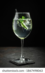 Hugo Cocktail With Champagne, Lime, Mint And Melissa Syrup On A Black Background, Aperitif Drink