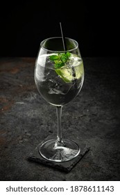 Hugo Cocktail With Prosecco, Lime, Ice, Mint And Melissa Syrup On A Stone Background, Aperitif Drink