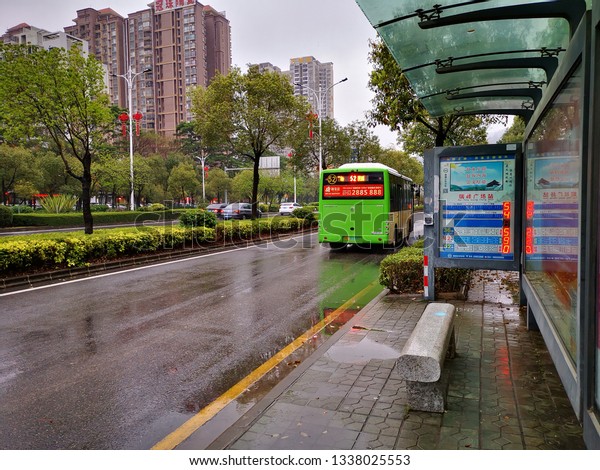 Huizhou, China - Mar 2019: The\
bus passes through the bus stop of Ruifeng Plaza in Huicheng\
District