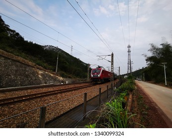 Huizhou, China - MAR 2019: A passenger train is driving on the Beijing-Kowloon Railway. The train uses a Hexie 1D type train engine head. - Shutterstock ID 1340099324
