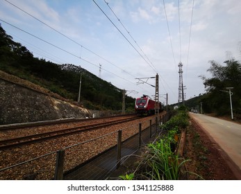 Huizhou, China - MAR 2019: A passenger train is driving on the Beijing-Kowloon Railway. The train uses a Hexie 1D type train engine head. - Shutterstock ID 1341125888