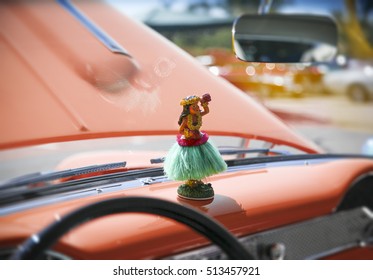 Hula Girl Statuette On Dashboard Of A Vintage Antique Car