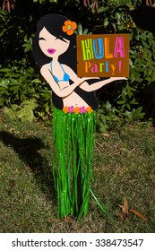 A Hula Girl Yard Sign For A Luau Party
