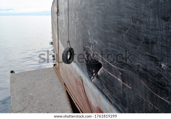 The hull of a cargo ship that was leaking due\
to a collision
