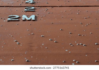 Hull of the ship covered by shells. The vessel is removed form the water to maintain the hull in dry dock
