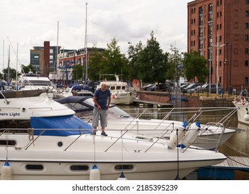 Hull, UK 07 29 2022 Man Cleaning A Boat            