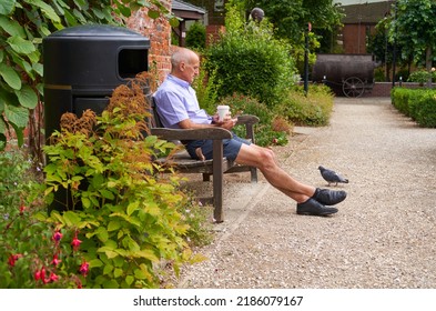 Hull, UK 07 30 2022 Man Relaxing In A Park