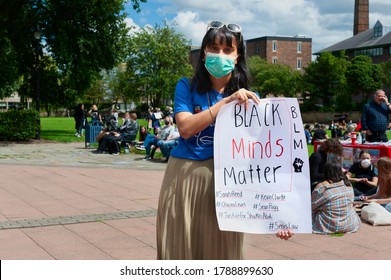 HULL, UK - JULY 11, 2020: Protester rally in favour of Black Lives Matter meeting wearing Corona Virus mask on July 11, 2020 in Hull, Humberside, UK.