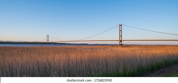 HULL, UK - MAY 05, 2020: A view of the Humber Bridge over the grasses on the South Bank