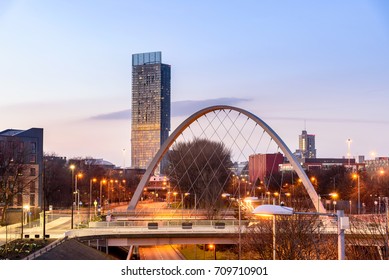 The Hulme Arch Bridge and Beetham Tower on a skyline of  Manchester, England.